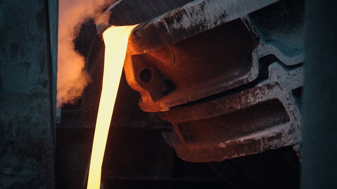 Molten metal pouring from a foundry ladle